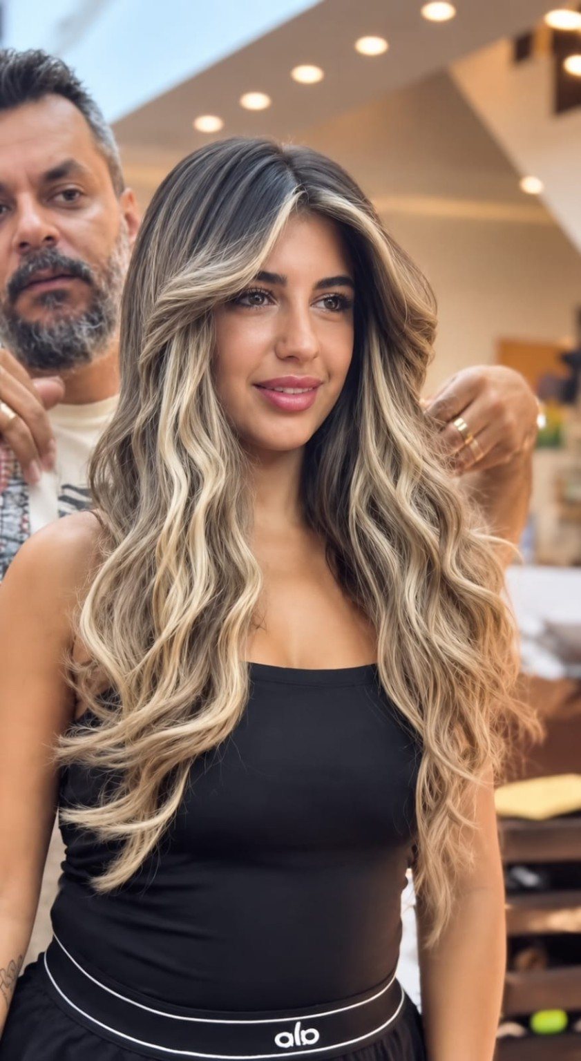 Voluminous highlighted waves styled at HairDose